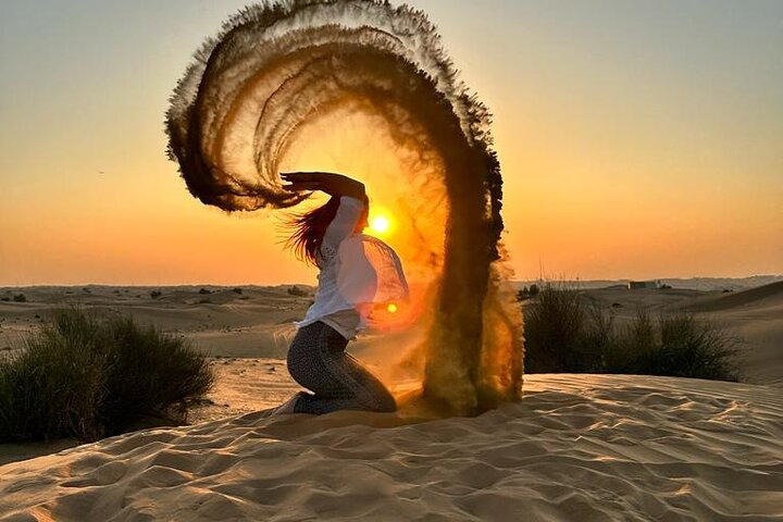 Experience the magic of Dubai's desert at sunset where sandy dunes meet captivating performances and delicious cuisine creating unforgettable memories under the starry sky.